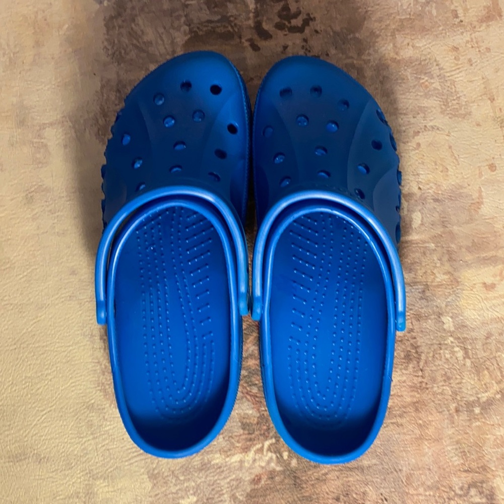 Used Size 13 Blue Crocs. Lightly worn. Rare color.
